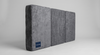 Castaway Bed 31-inch center platform mattress shown in three segmented sections with grey velvet cover and Castaway branded label, designed to fit the floor-anchored center platform when the motorized split king bed is in the open position