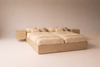 Castaway Bed motorized split king bed in closed position without headboard, angled three-quarter view showing attached floating nightstands with drawers on both sides and sturdy platform base construction